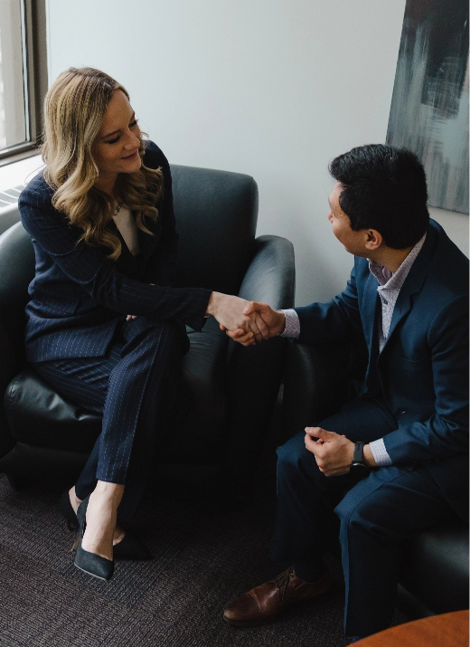 Advisor with client shaking hands
