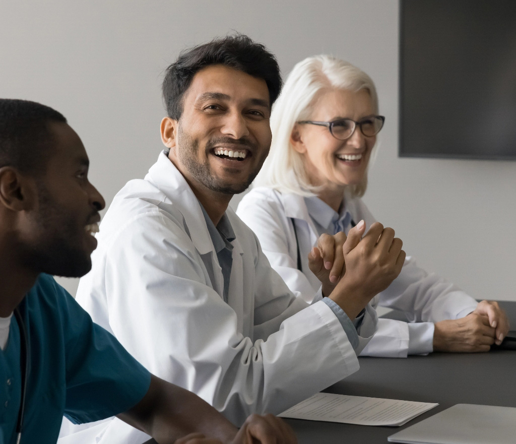 Medical professionals in boardroom tablet