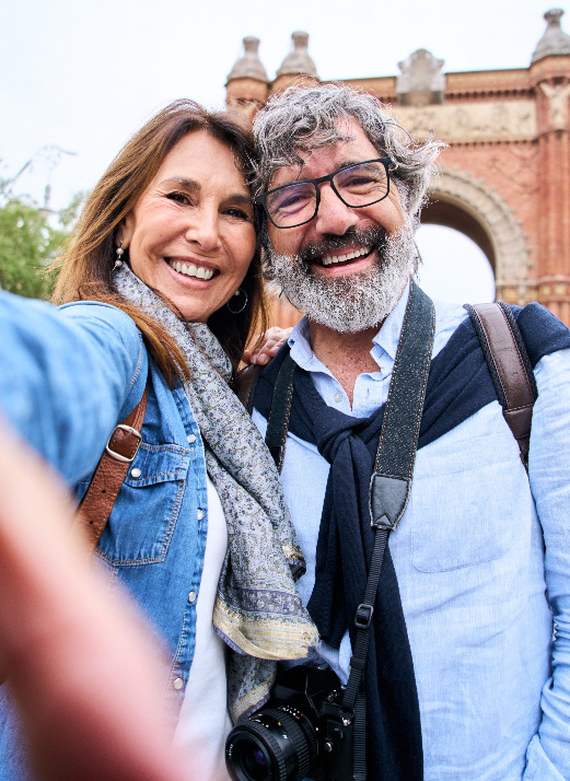 Middle aged couple taking selfie travelling