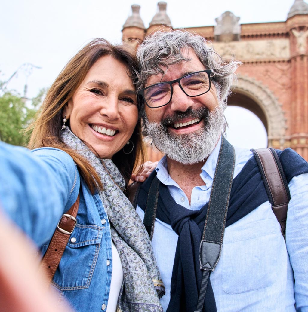 Middle aged couple taking selfie travelling mobile