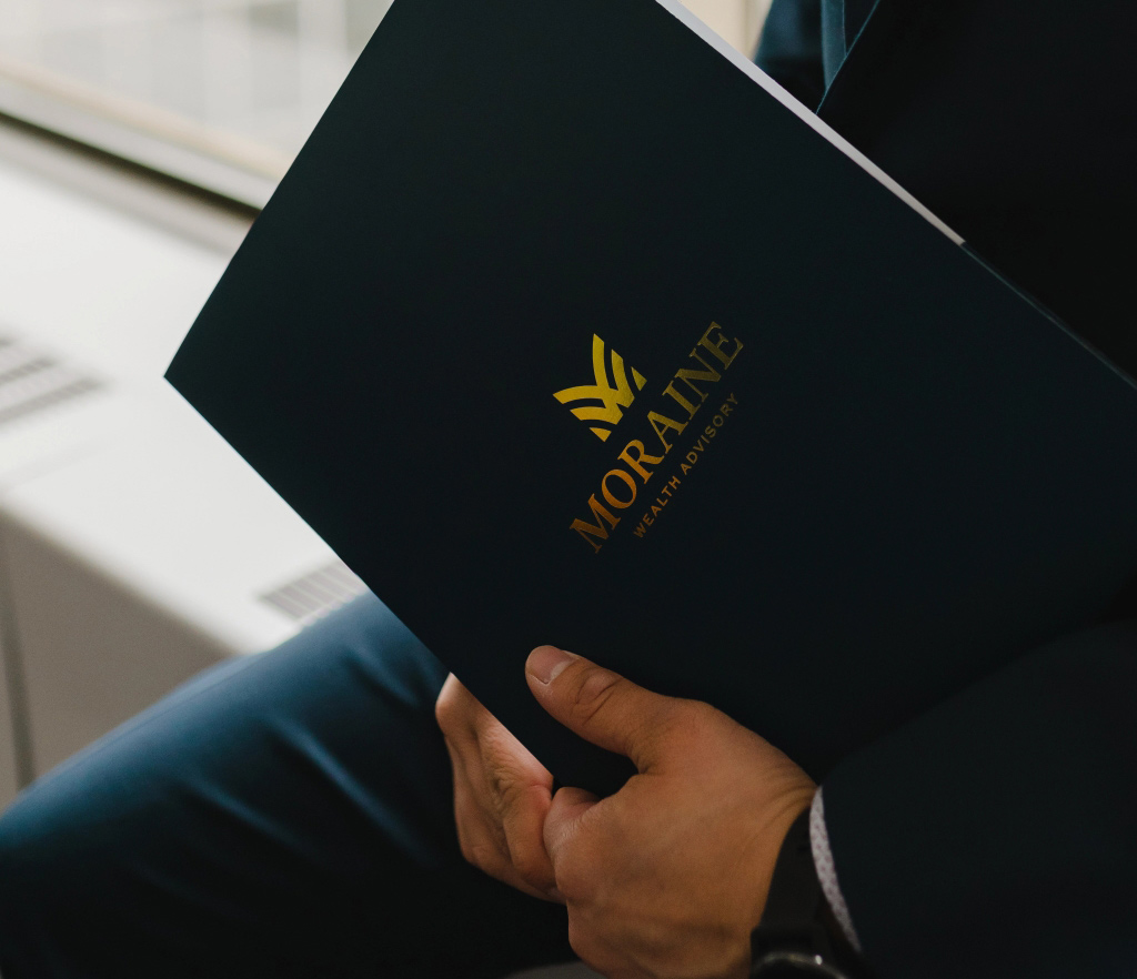 Moraine wealth associate holding portfolio tablet