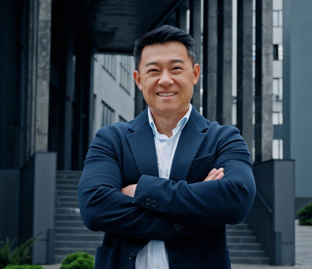 Successful business man with arms folded 2 tablet