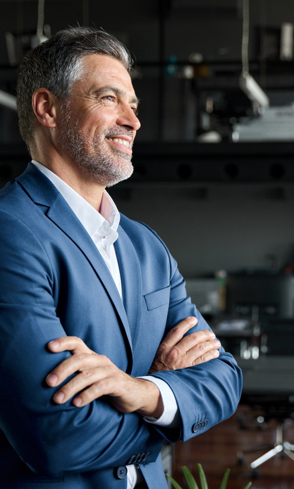 Successful business man with arms folded