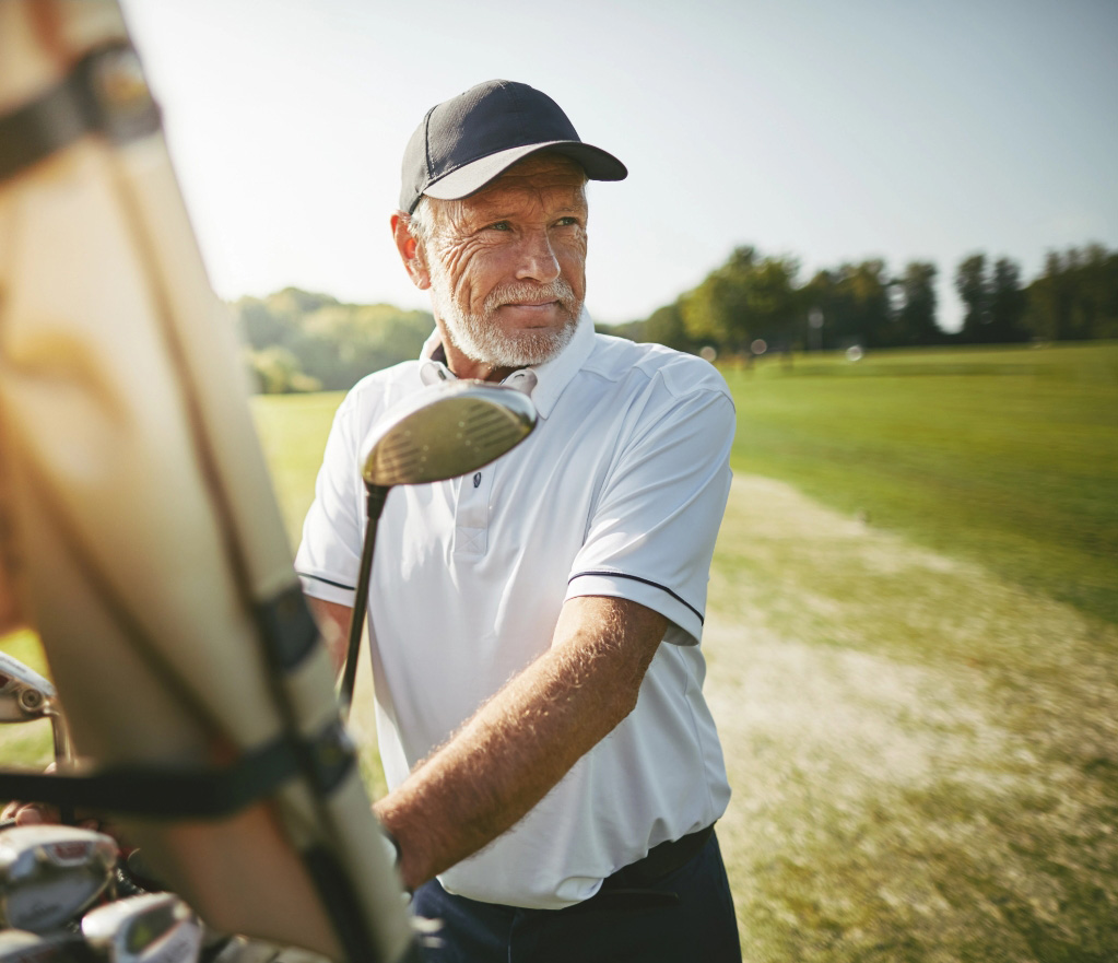 Successful older man golfing tablet