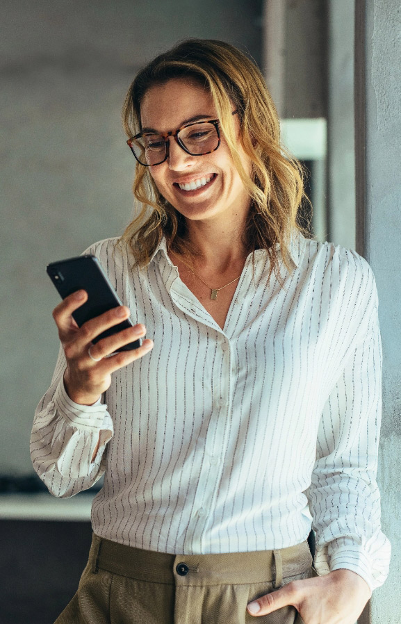 Successful woman smiling with phone