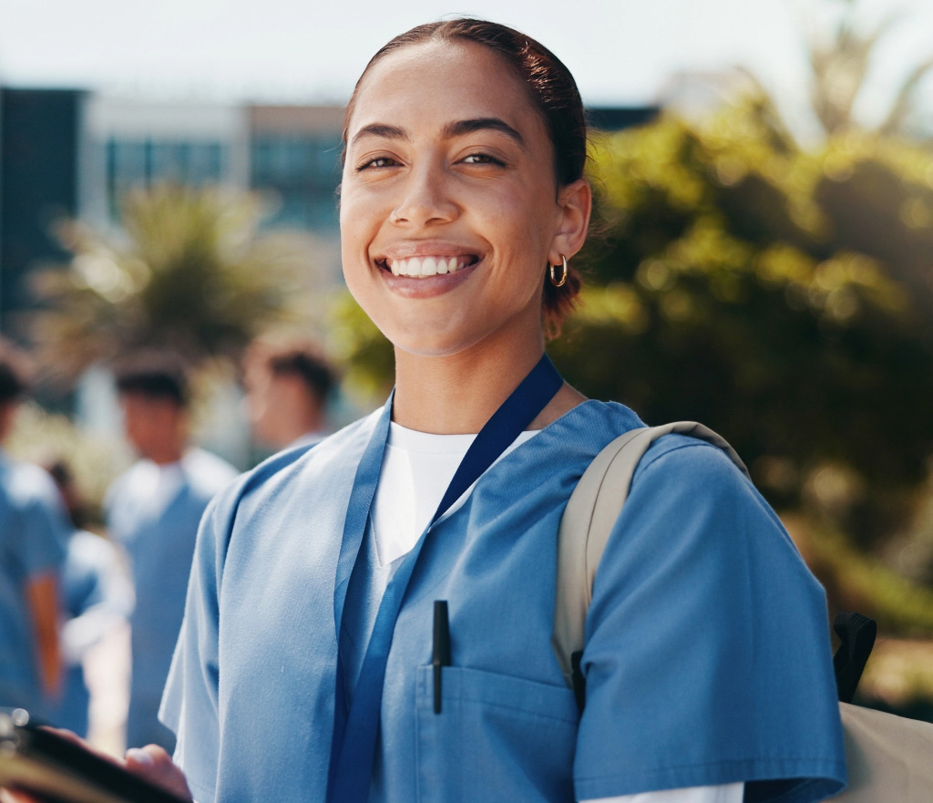 Young female medical professional smiling tablet